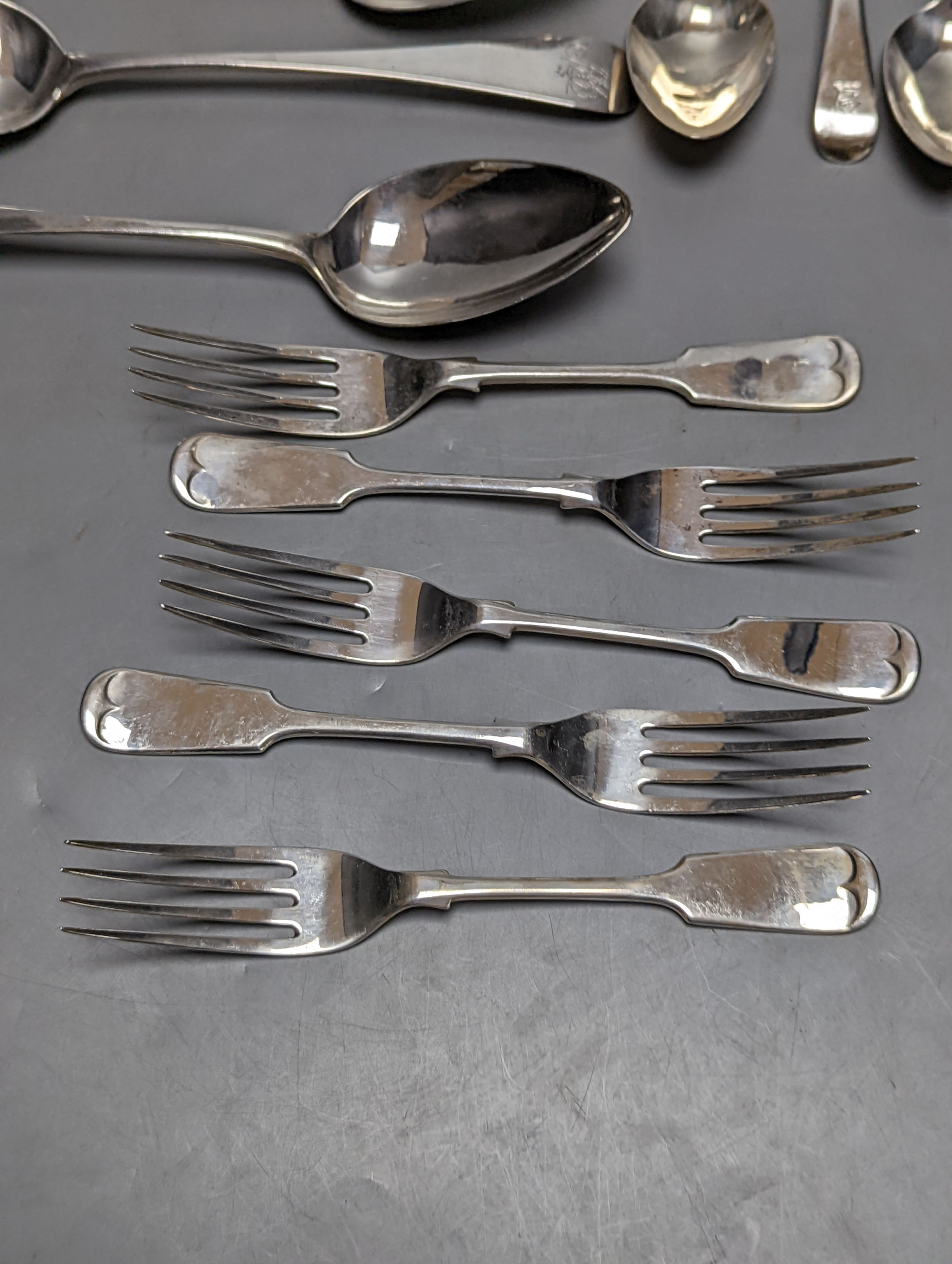 Fourteen items of 19th century and later silver flatware, various patterns, dates and maker's including three tablespoons by Eley & Fearn, London, 1817, 23oz.